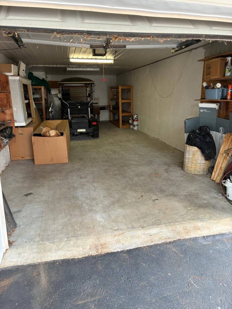 Cleared garage after a junk removal cleanout in Dallas, GA by Best in Town Junk Removal