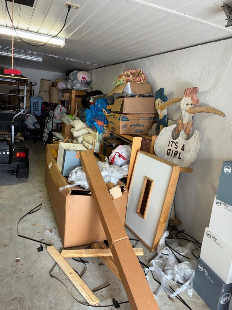 Cluttered garage before a junk removal cleanout in Dallas, GA